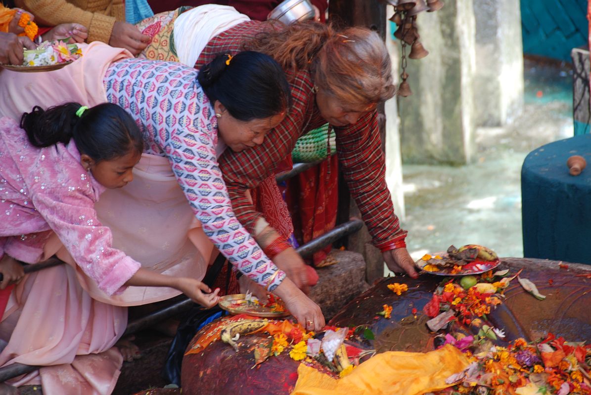 Kathmandu Valley 1 Budhanikantha 5 Pilgrims Making Offerings At Sleeping Vishnu The Hindu pilgrims are allowed to enter Budhanilkantha Narayan (Sleeping Vishnu) after the priests are finished and make offering and touch Vishnu�s feet.